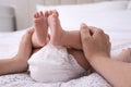 Mom with her baby in diaper at home, closeup Royalty Free Stock Photo