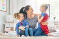 Mom and her daughters are playing