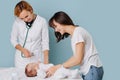 Mom and her infant son at the doctor appointment Royalty Free Stock Photo