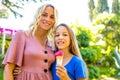 Mom with her kid baby eating ice cream in park and smiling in tropical beach Royalty Free Stock Photo