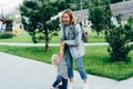 Mom and her little daughter have fun in the park, play and laugh. Royalty Free Stock Photo