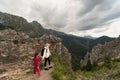 Mom with her little daughter on a hike in the Tatra Mountains, the sky is covered with storm clouds