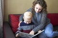Mom with her little son is reading a book Royalty Free Stock Photo