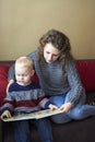 Mom with her little son is reading a book Royalty Free Stock Photo