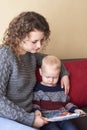 Mom with her little son is reading a book Royalty Free Stock Photo