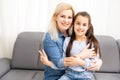 Mom with her pre teen daughter hugging, positive feelings, good relations. Royalty Free Stock Photo