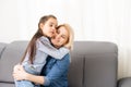 Mom with her pre teen daughter hugging, positive feelings, good relations. Royalty Free Stock Photo