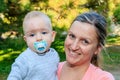 Mom holds her baby in her arms. Emotional picture of a happy moment between mother and son. Emotion, love