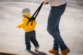 Mom insures her child during a walk