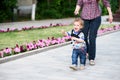 Mom insures her child during a walk