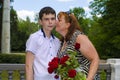 Mom intends to kiss her son.