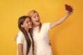 mom and kid blogging. happy woman and girl take selfie with mobile phone. selfie family Royalty Free Stock Photo