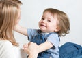 Mom and kid having fun pastime. Parenthood Royalty Free Stock Photo