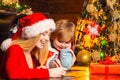 Mom and kid play together christmas eve. Happy family. Family holiday. Santa claus coming. Mother and little child boy Royalty Free Stock Photo