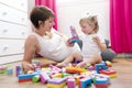 Mom and kid playing block toys at home Royalty Free Stock Photo