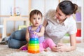 Mom and kid playing block toys at home Royalty Free Stock Photo