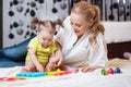 Mom and kid playing block toys at home Royalty Free Stock Photo