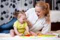 Mom and kid playing block toys at home Royalty Free Stock Photo