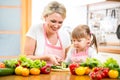 Mom and kid preparing healthy food Royalty Free Stock Photo