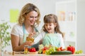 Mom and kid preparing healthy food Royalty Free Stock Photo