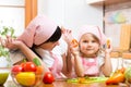 Mom and kid preparing healthy food Royalty Free Stock Photo