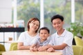 Mom and kids in restaurant. Asian family