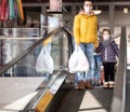 Mom and kids are shopping at the grocery store Royalty Free Stock Photo