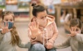 Mom and kids are shopping at the grocery store Royalty Free Stock Photo