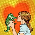 Mom kisses crocodile, naughty baby concept Royalty Free Stock Photo