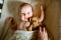 Mom lays down the baby to sleep. sheltering blanket Royalty Free Stock Photo