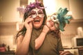 Mom lets hide with mask. Little girl have play with mother. Royalty Free Stock Photo