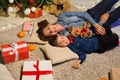 Mom with little boy Christmas tree with new year holiday gifts Royalty Free Stock Photo