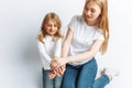 Mom and little daughter looking at each other, happy family, isolated background, cute and beautiful Royalty Free Stock Photo