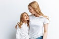 Mom and little daughter looking at each other, happy family, isolated background, cute and beautiful Royalty Free Stock Photo