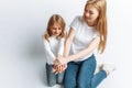 Mom and little daughter looking at each other, happy family, isolated background, cute and beautiful Royalty Free Stock Photo