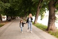 The mom and little girl walk around the city are holding hands Royalty Free Stock Photo