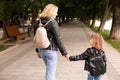 The mom and little girl walk around the city are holding hands Royalty Free Stock Photo