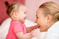 Mom looks with love at baby. Parenthood happiness Royalty Free Stock Photo