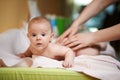 Mom makes baby massage a little surprised