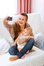 Mom making photos with her lovely baby