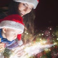 Mom opens the magic box with a gift for child Royalty Free Stock Photo