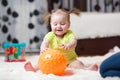 Mom playing ball with baby indoor Royalty Free Stock Photo