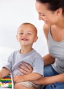 Mom playing with happy toddler in home with toys, bonding and child care with abacus in morning on bed. Woman, playful Royalty Free Stock Photo