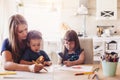Mom drawing with her children Royalty Free Stock Photo
