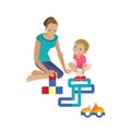 Mom plays with child, helping assemble constructor, playing in machines. Royalty Free Stock Photo