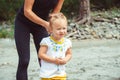 Mom plays with her daughter in the sand Royalty Free Stock Photo