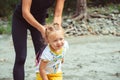 Mom plays with her daughter in the sand Royalty Free Stock Photo