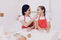 Mom Praises Little Girl for a Good Work in the Kitchen. Royalty Free Stock Photo