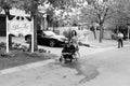 Mom with pram and Mailman delivering mail in a wealthy suburban Royalty Free Stock Photo