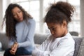 Mom or psychologist tries to talk to upset african girl Royalty Free Stock Photo